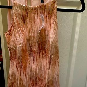 WHBM NEVER WORN BEFORE AND TAGS STILL ATTACHED. Beautiful gold. For night out